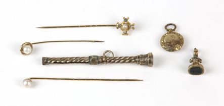 A group of gold items, including three stick pins set with pearls, two in 9 ct, one in 14 ct,