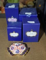 A group of five boxed Royal Crown Derby porcelain paperweights, to include a harvest mouse,