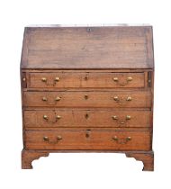 George III oak bureau, the fall front revealing fitted interior above four long drawers,
