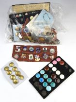 Large collection of badges and buttons, some with military emblems (Qty)