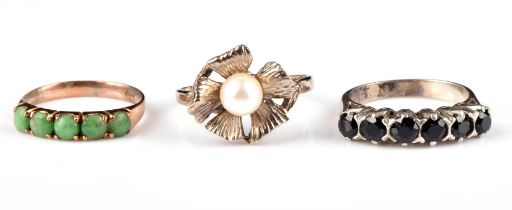 Three rings, including a floral motif pearl ring in 18 ct, size P, a five stone sapphire ring