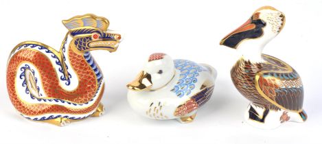 Two Royal Crown Derby porcelain animal paperweights, to include a dragon, with printed mark,