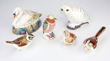 A group of six Royal Crown Derby porcelain paperweights, to include a swan, a snowy owl,