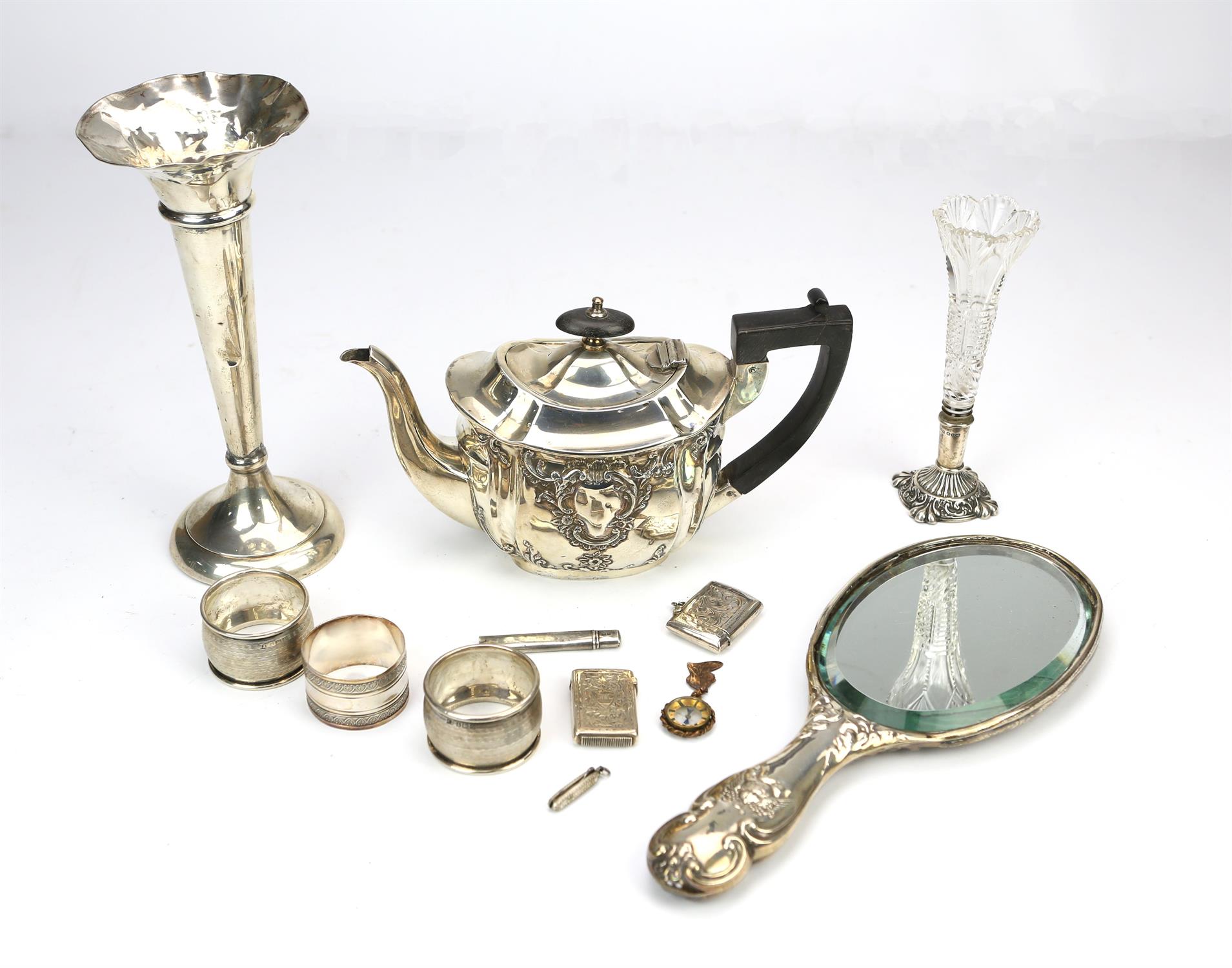 Small embossed silver teapot, Chester 1889, silver backed "Cherub" hand mirror, Chester 1903,