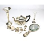 Small embossed silver teapot, Chester 1889, silver backed "Cherub" hand mirror, Chester 1903,