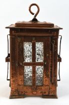 An Arts and Crafts style copper hanging lantern, in the style of John Pearson, with frosted glass