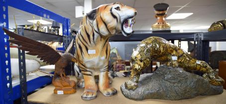 Ceramic model of a tiger, 49cm , a resin sculpture of a leopard, and a carved model of an eagle,