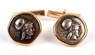 Cufflinks, set with white metal coins in the centre, in stamped 14 ct mounts