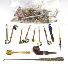 Collection of tools, to include lace making bobbins, a pipe, bone glove stretchers, boot hooks,