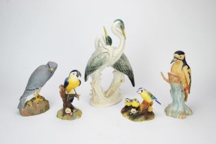 German porcelain model of a pair of heron, 20th Century, together with two Royal Crown Derby models