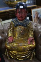 Asian painted hardwood figure of a seated man, deep in meditation, 74cm high
