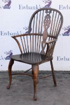 A George III style elm, ash and beechwood windsor chair, early 20th century, on cabriole front legs