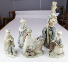 Lladro, a group of four figures to include a large chimney sweep, 43cm high, a figure of an Arab,
