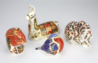 A group of four Royal Crown Derby porcelain paperweights, to include a bear with silver stopper,