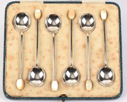 Cased set of silver spoons with mop finials.