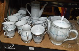 A Noritake porcelain tea, coffee and dinner service, the Pledge pattern, to include a teapot,