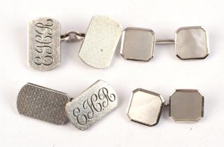 Two pairs of silver cufflinks.