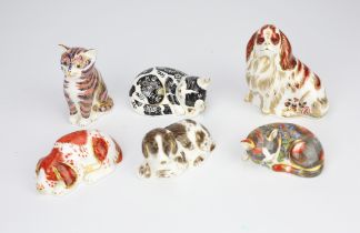 A group of six Royal Crown Derby porcelain paperweights, to include a Cavalier King James Spaniel,