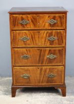 An Edwardian mahogany chest of drawers, inlaid with satinwood banding and stringing,