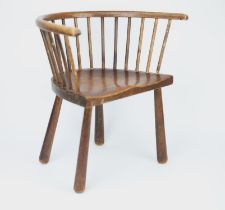 An Edwardian ash and alder child's chair, of stick back form and with solid seat and tapered legs