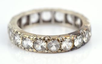 Full eternity ring, set with round cut spinels, mounted in tested 14 ct, size L