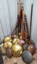 Collection of twelve brass bedwarmers, with turned wooden handles (12)