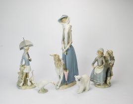 A group of ten Lladro porcelain figures, to include a large figure of a lady with greyhound,