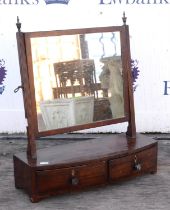 A Regency mahogany bowfront toilet mirror, with reeded uprights and two drawers, W 51cm