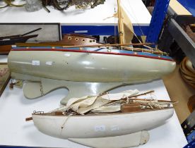 Two model pond yachts, 20th Century, both with rigging, the tallest 130cm high (2)