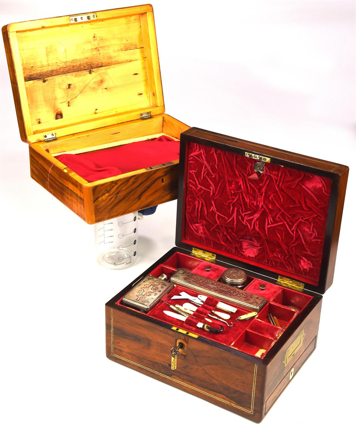 A Victorian rosewood dressing box, inlaid with stringing and with side handles and lateral drawer,