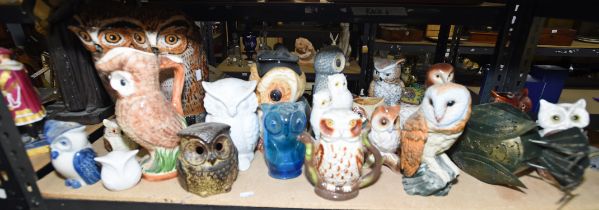 A large group of pottery and porcelain owls, 20th century, to include a gold buttoned Royal Crown