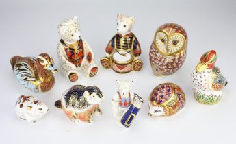 A group of nine Royal Crown Derby paperweights, to include three teddy bears, an owl, a rabbit,