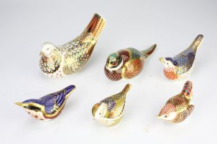A group of six Royal Crown Derby porcelain paperweights, to include a dove, a woodland pheasant,