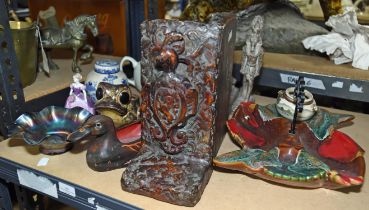 A pair of lacquered terracotta bookends, with armorials, H 28cm, together with a small Satsuma bowl,