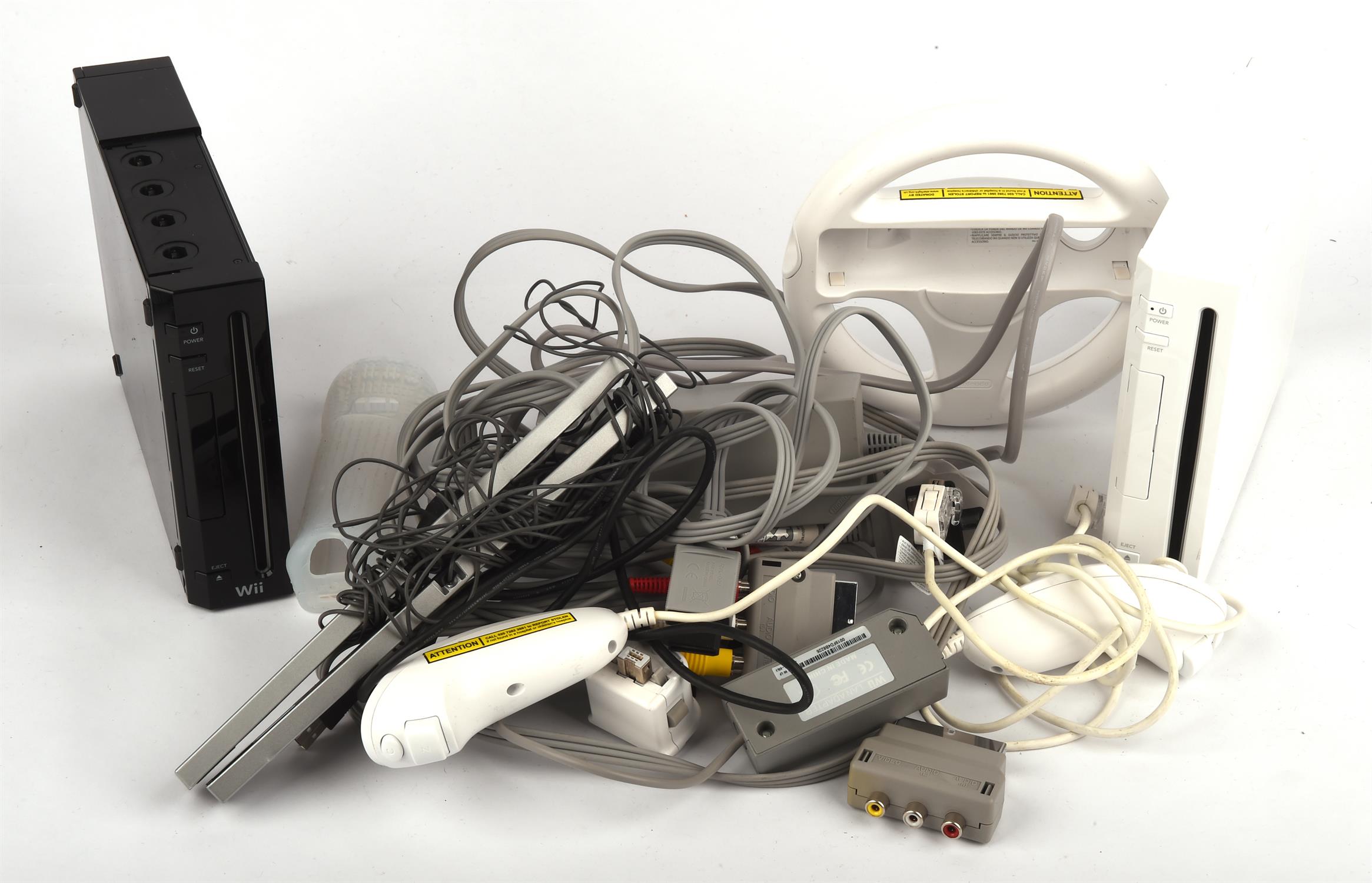 2 Nintendo Wii Consoles (one black and one white) and an assortment of cables and accessories