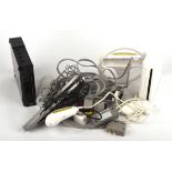 2 Nintendo Wii Consoles (one black and one white) and an assortment of cables and accessories