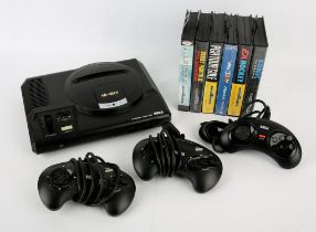 Sega Mega Drive 16-Bit console with 6 games, 3 controllers and power supply Games include: Sonic