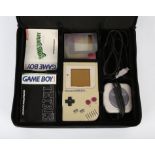 Game Boy original handheld console with loose Tetris game, a 4-player adapter and an assortment of