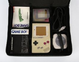Game Boy original handheld console with loose Tetris game, a 4-player adapter and an assortment of