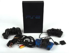 PlayStation 2 (PS2) console with 3 controllers Console is unboxed and comes with the official plug