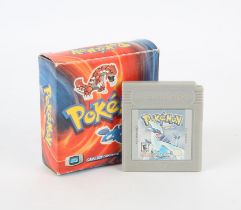 Pokémon Silver loose cartridge Game Boy game (NTSC) and a Pokémon Ruby & Sapphire mini auto-scan FM