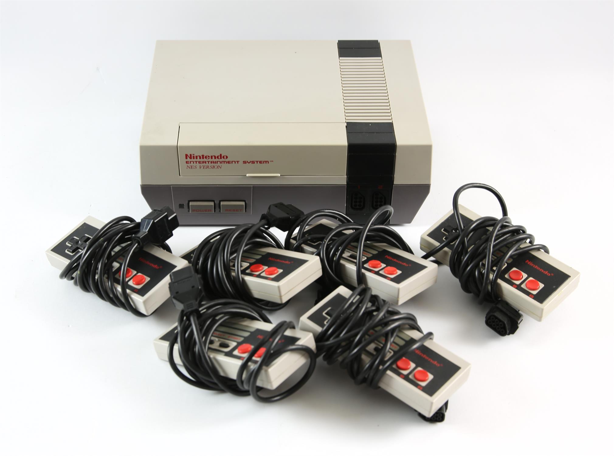 Nintendo Entertainment System (NES) with 6 controllers and power supply