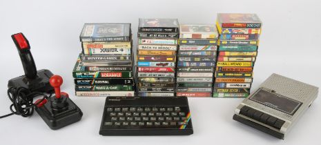 ZX Spectrum 48K with accessories, cables & 50+ games This lot also contains a Euromatic cassette