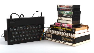 ZX Spectrum with power plug, manuals and games Game highlights include: Planetoids,
