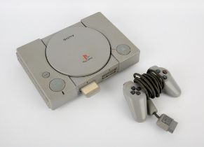 PlayStation 1 (PS1) loose console + Tomb Raider: Chronicles (disc only/inside console) controller &