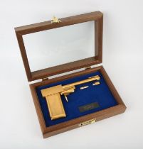James Bond The Man With The Golden Gun - A replica golden gun, 24 karat gold-plated replica