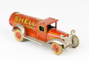 An early 20th century German tinplate clockwork Shell Motor Spirit tanker by George Fischer.