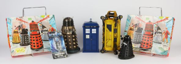 A collection of Doctor Who related collectors merchandise including puzzles and model Daleks also