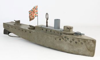 An early 20th century scratch built wooden clockwork model of a Naval warship, length 46cm.