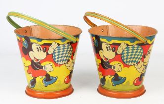 A pair of 50s metal Mickey Mouse buckets, with swing handles, undersides impressed 'British Made',